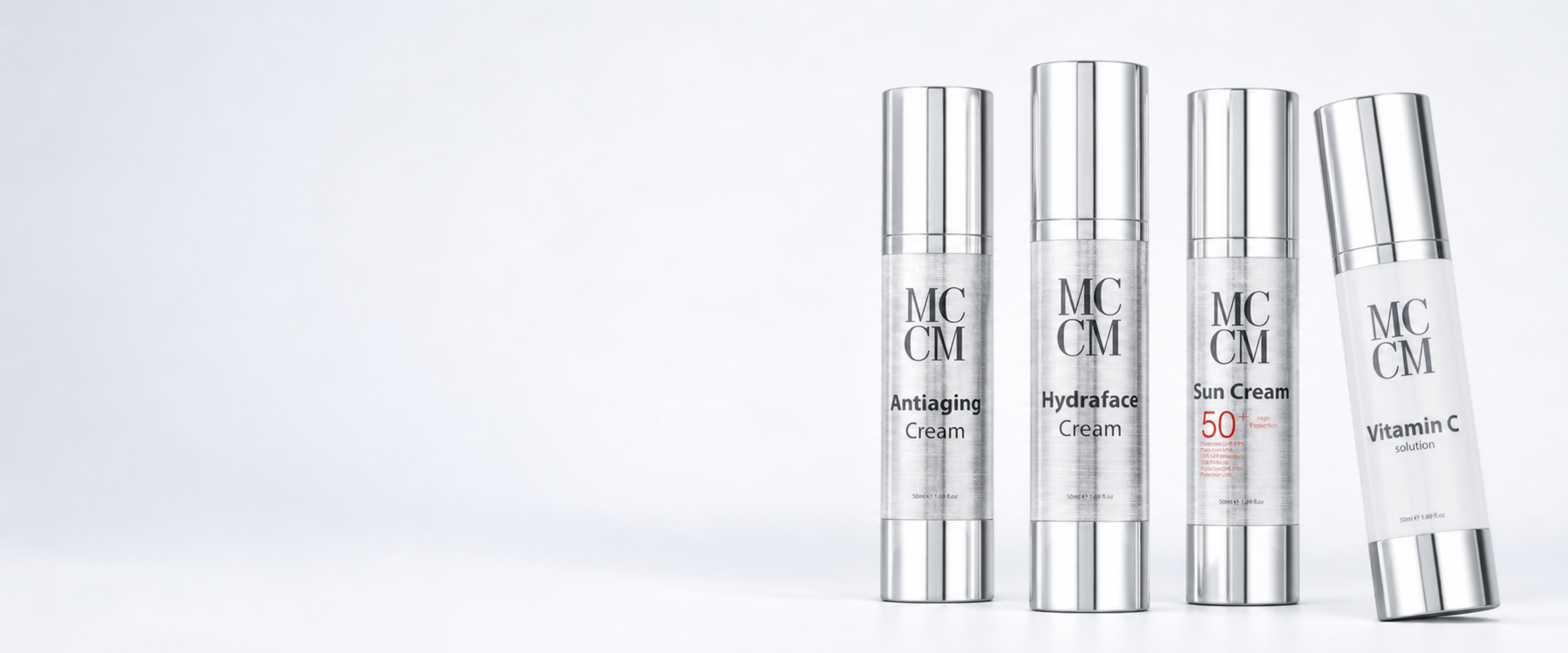 Four MCCM skincare cream bottles with silver caps arranged on a clean white background. The bottles are labeled Antiaging Cream, Hydraface Cream, Sun Cream 50, and Vitamin C.